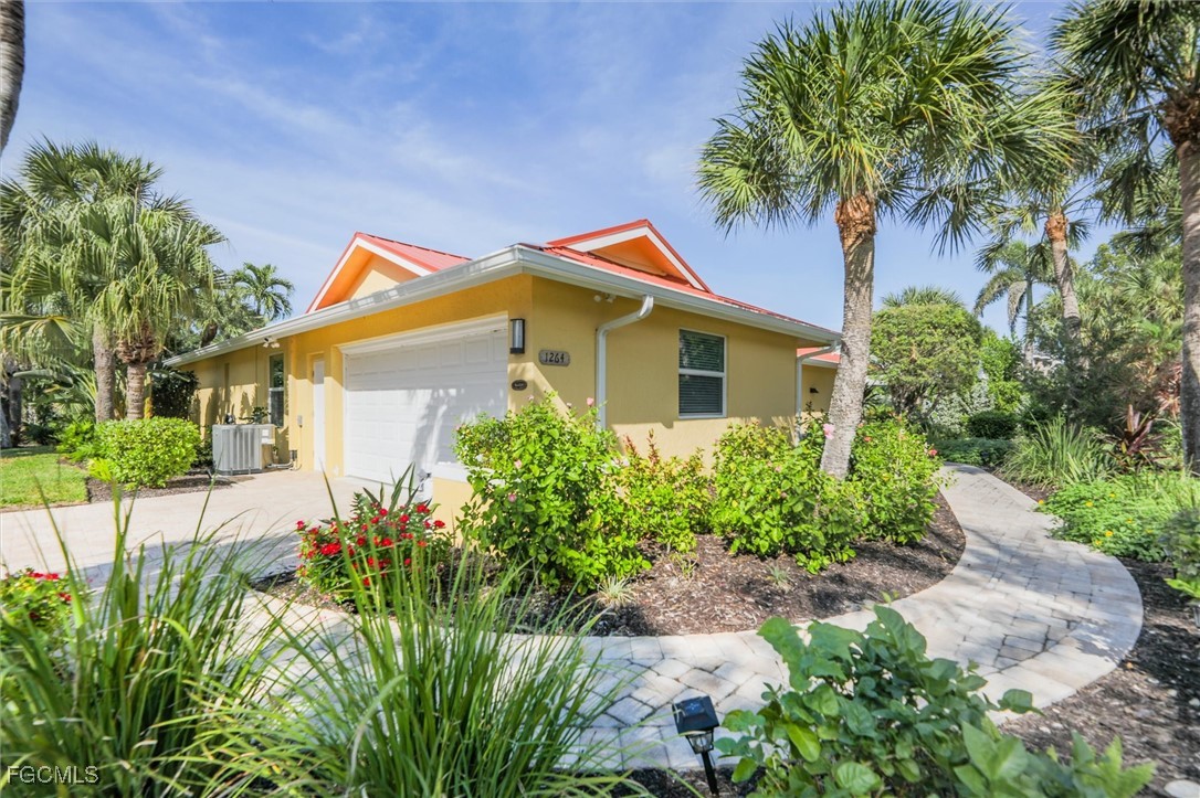 1264 Par View Drive Sanibel, FL 33957 - Photo 14 of 50 a front view of a house with a garden