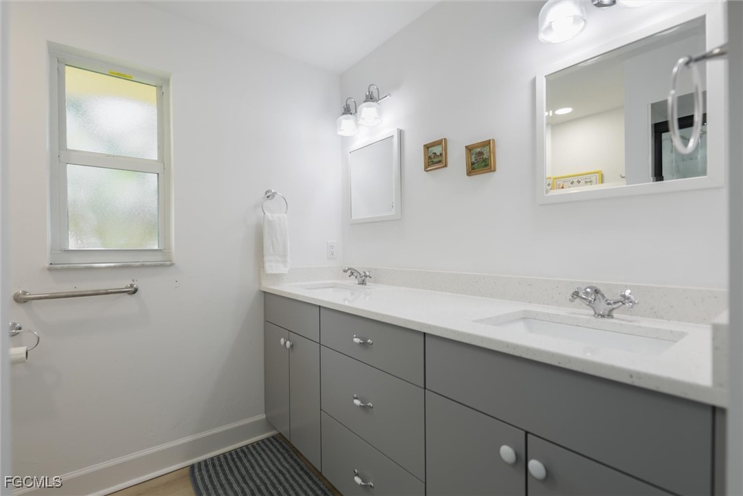 1264 Par View Drive Sanibel, FL 33957 - Photo 28 of 50 a bathroom with a sink and a mirror