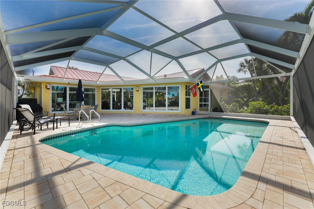 1264 Par View Drive Sanibel, FL 33957 - Photo 35 of 50 a view of a swimming pool with a patio