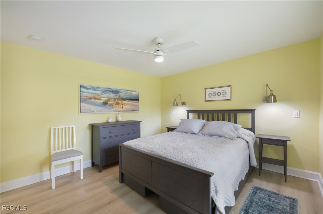 1264 Par View Drive Sanibel, FL 33957 - Photo 48 of 50 a bedroom with a bed and a table in it