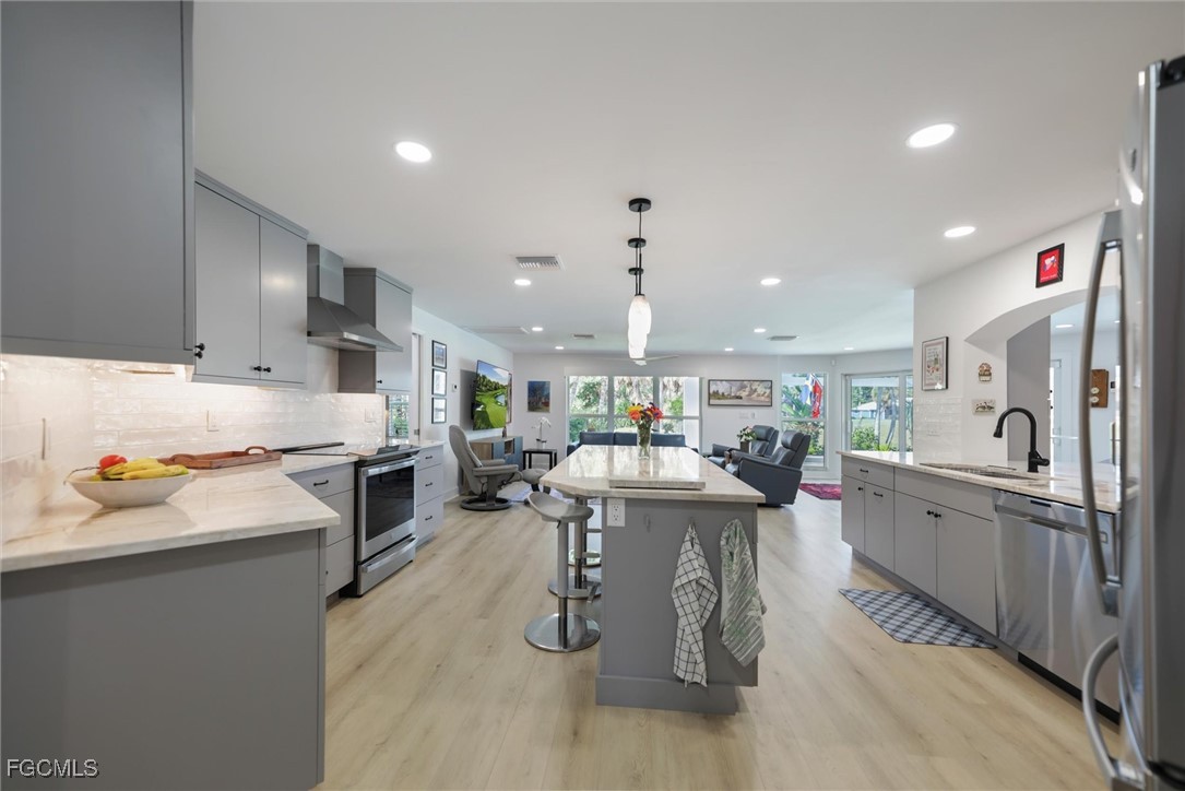 1264 Par View Drive Sanibel, FL 33957 - Photo 5 of 50 a kitchen with stainless steel appliances kitchen island granite countertop a sink and cabinets