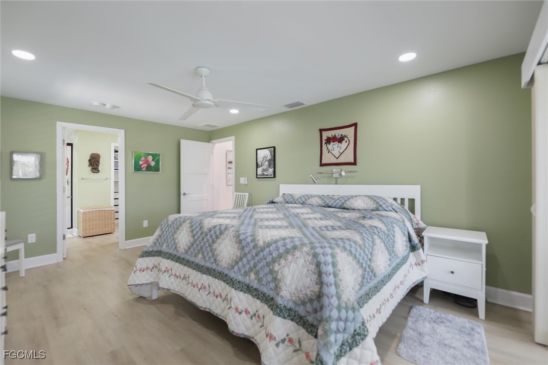 1264 Par View Drive Sanibel, FL 33957 - Photo 6 of 50 a spacious bedroom with a bed and a walk in closet