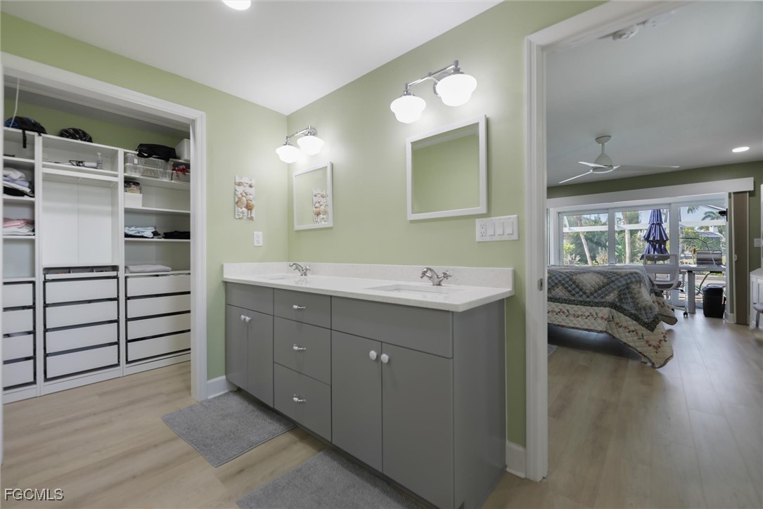 1264 Par View Drive Sanibel, FL 33957 - Photo 9 of 50 a spacious bathroom with a double vanity sink and a mirror