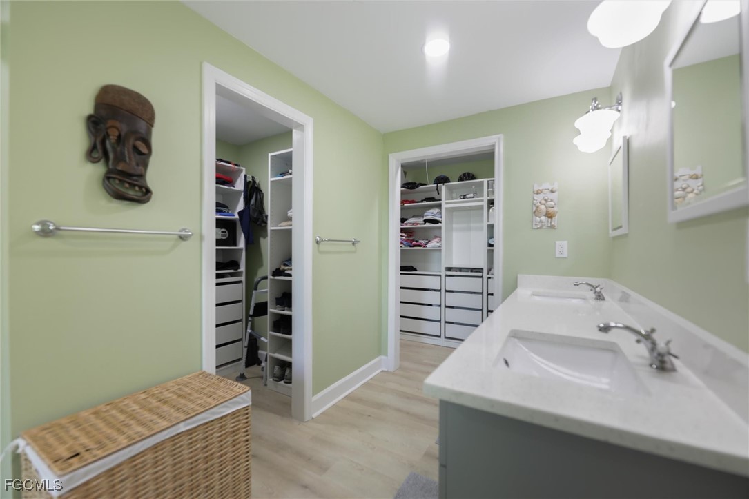 1264 Par View Drive Sanibel, FL 33957 - Photo 10 of 50 a bathroom with a sink and washing machine