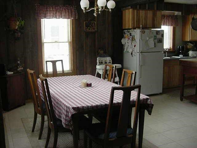 2152 Lancaster Heights Road Freeport, IL 61032 - Photo 8 of 9 a kitchen with a table chairs and refrigerator