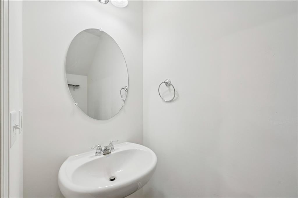1653 Vernon Boulevard Decatur, GA 30035 - Photo 11 of 24 a bathroom with a sink and mirror