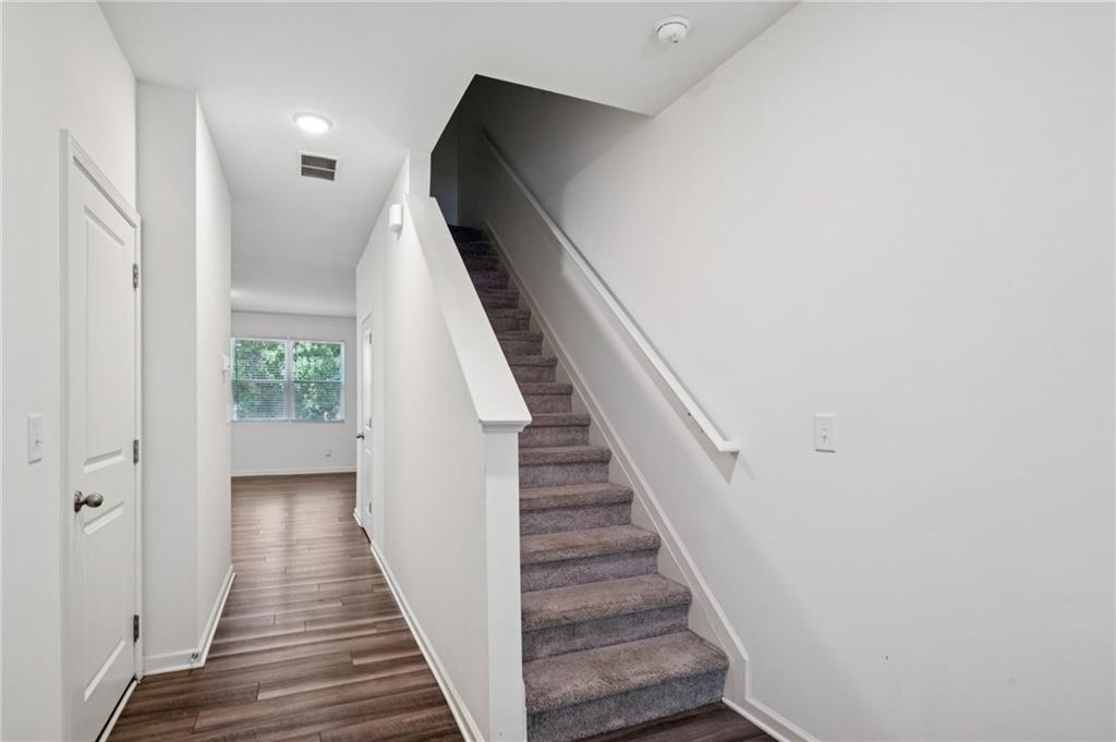 1653 Vernon Boulevard Decatur, GA 30035 - Photo 13 of 24 a view of a hallway with wooden floor and entryway