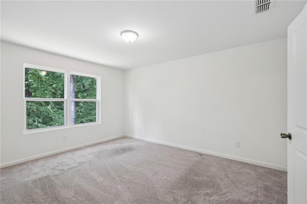 1653 Vernon Boulevard Decatur, GA 30035 - Photo 15 of 24 an empty room with a window