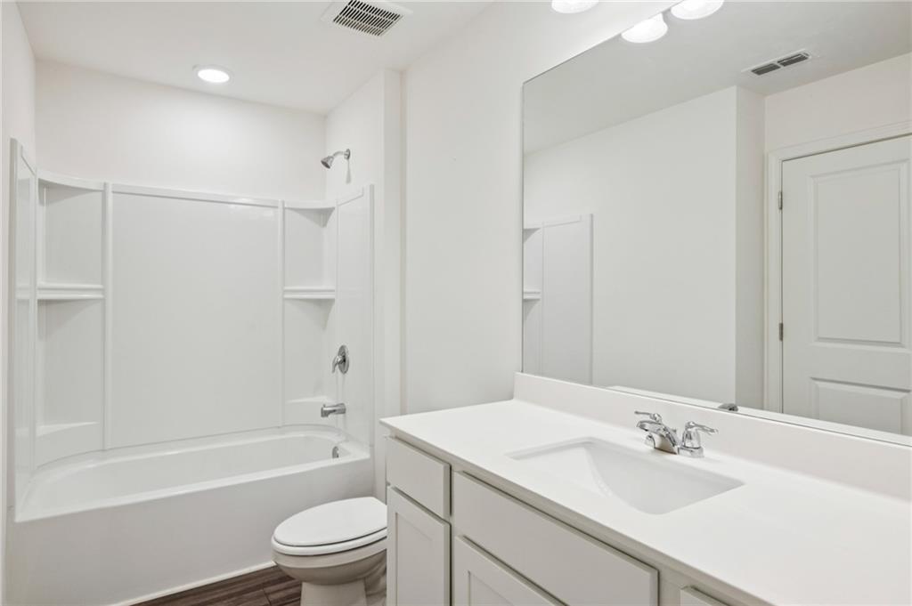 1653 Vernon Boulevard Decatur, GA 30035 - Photo 16 of 24 a bathroom with a sink a toilet and shower