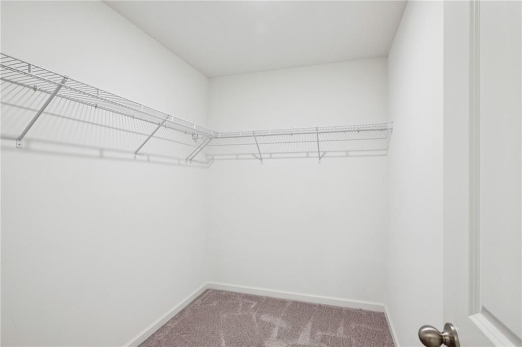 1653 Vernon Boulevard Decatur, GA 30035 - Photo 17 of 24 a view of a room with racks on the wall