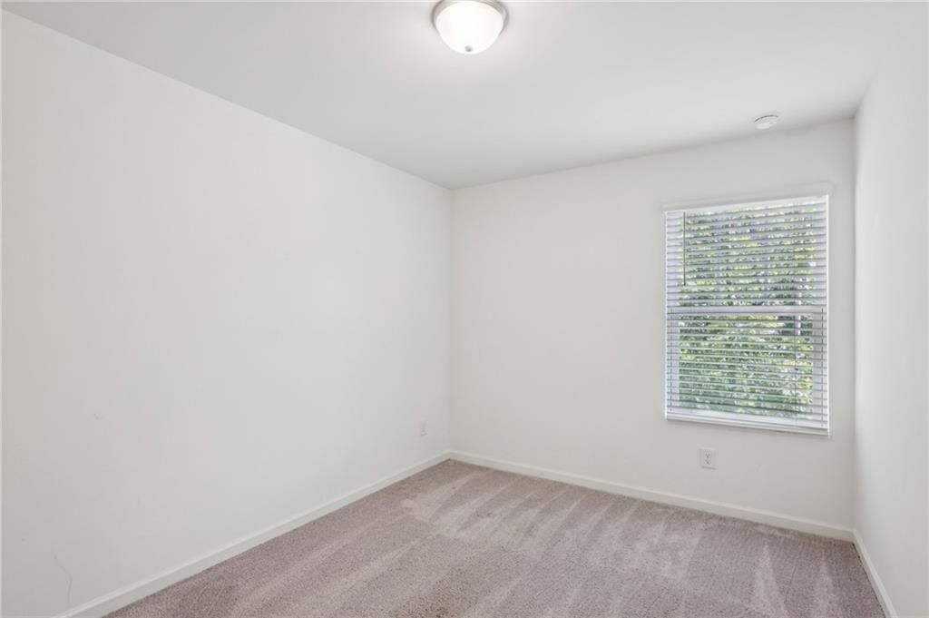 1653 Vernon Boulevard Decatur, GA 30035 - Photo 18 of 24 an empty room with windows