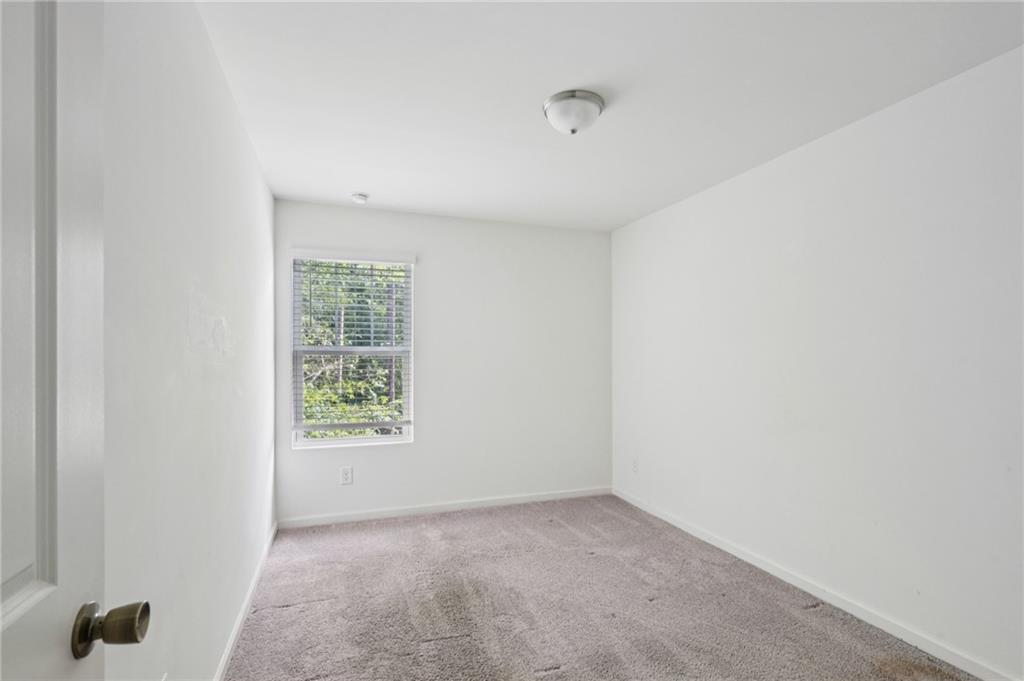 1653 Vernon Boulevard Decatur, GA 30035 - Photo 19 of 24 a view of an empty room and a window