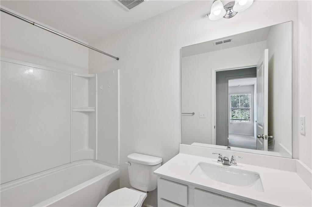 1653 Vernon Boulevard Decatur, GA 30035 - Photo 20 of 24 a bathroom with a sink toilet and shower