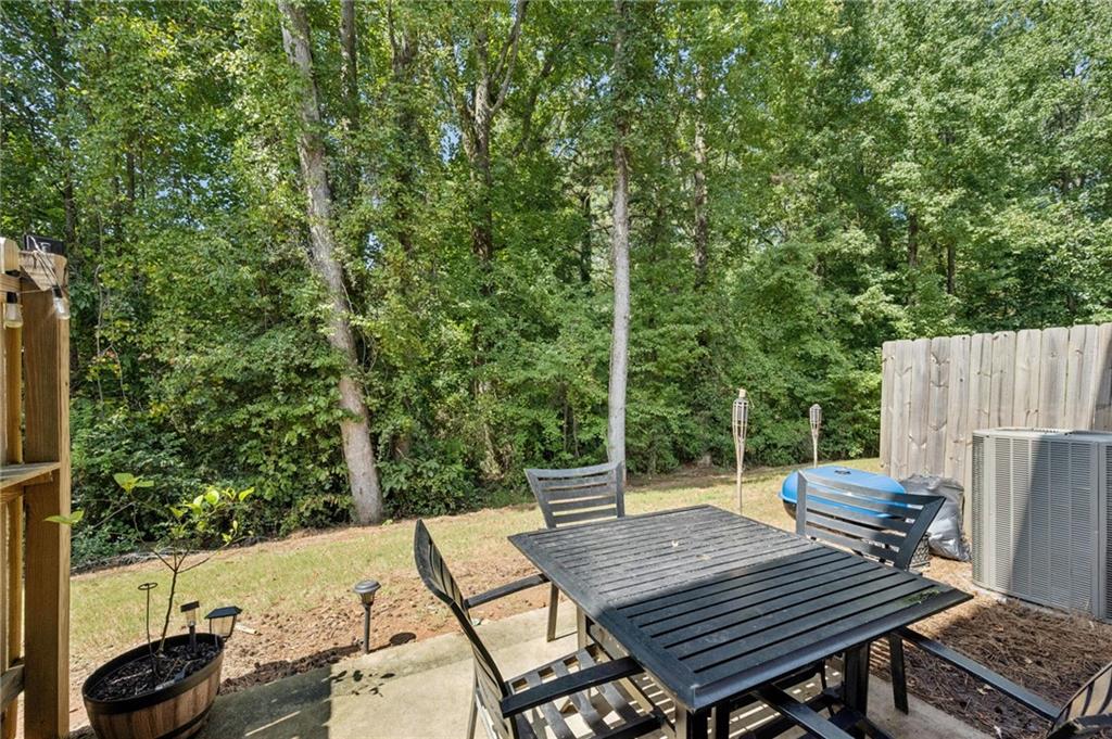 1653 Vernon Boulevard Decatur, GA 30035 - Photo 22 of 24 a wooden bench sitting on top of a wooden deck