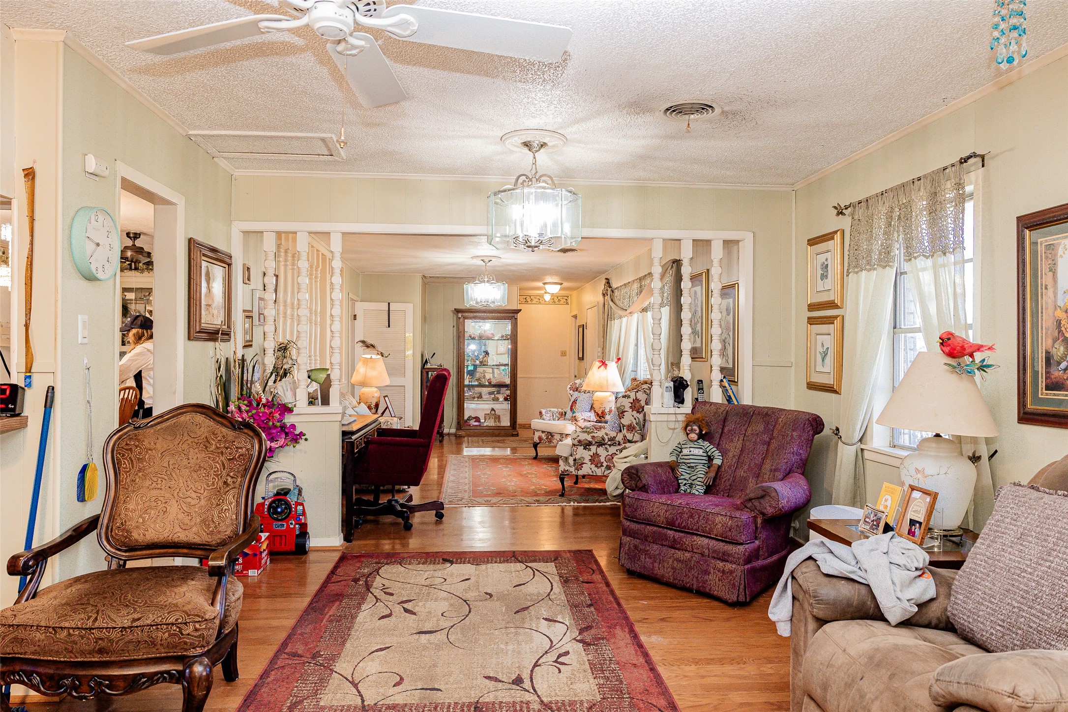 8608 Captain Scott Road Brenham, TX 77833 - Photo 8 of 28 a living room with patio furniture and a chandelier