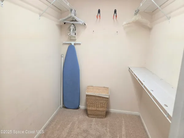 a view of a hallway with stairs