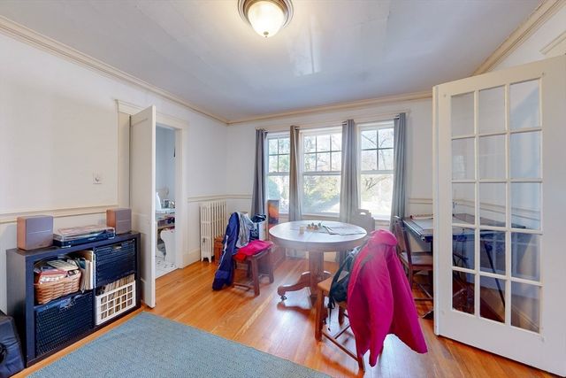 a view of a livingroom with furniture and a large window
