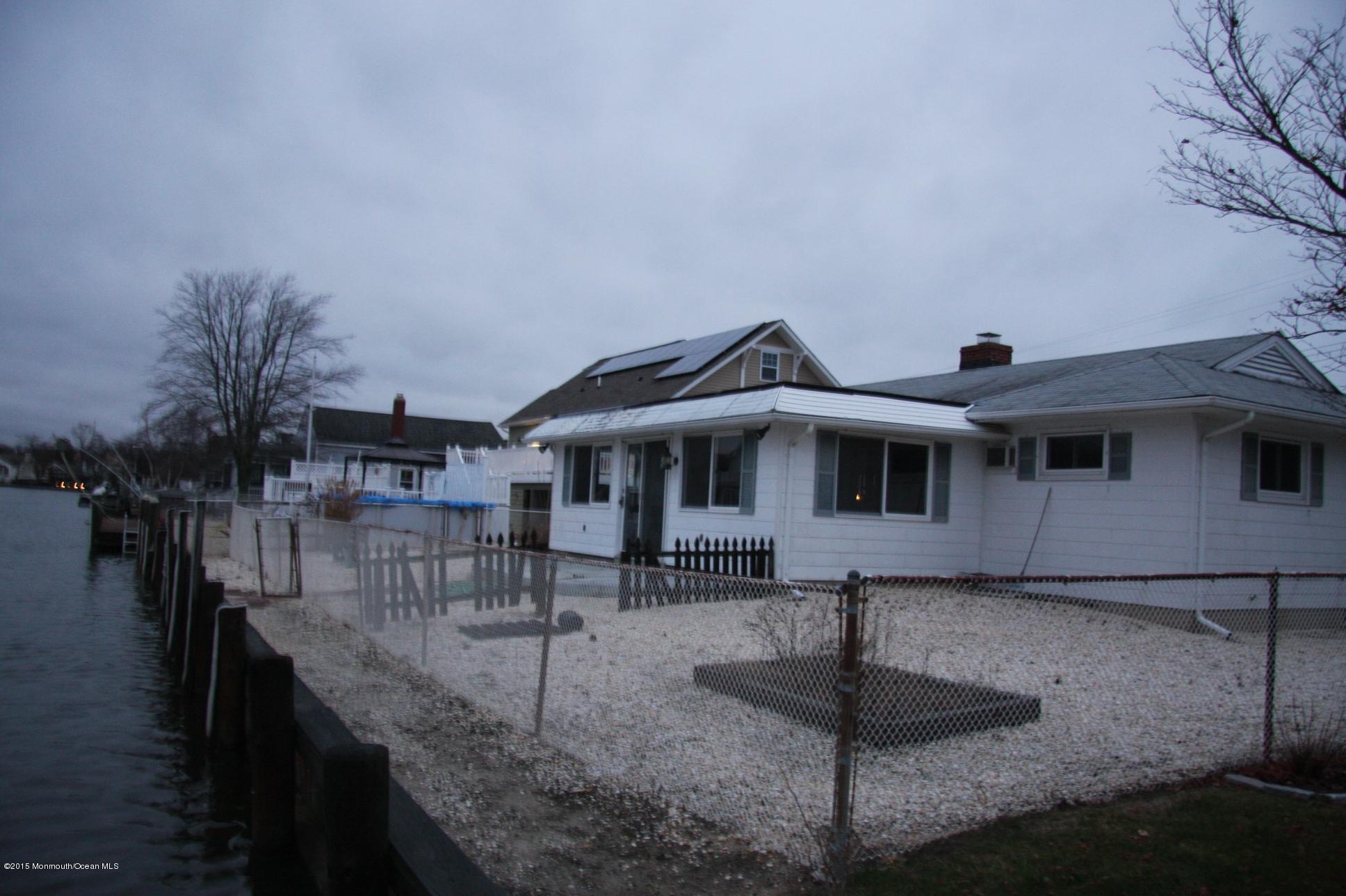 731 Drum Point Road Brick, NJ 08723 - Photo 7 of 11 a front view of a house with yard