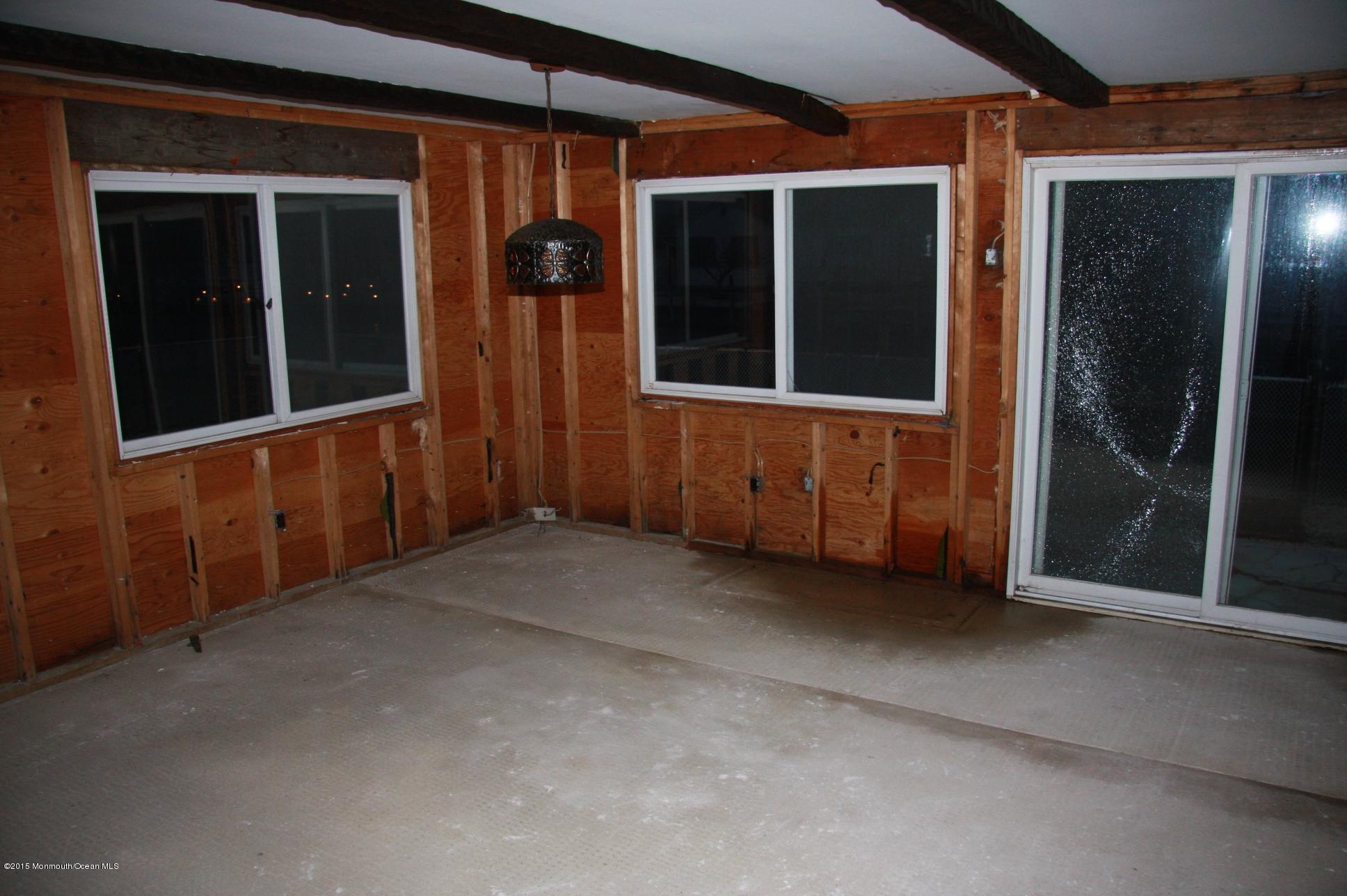 731 Drum Point Road Brick, NJ 08723 - Photo 9 of 11 an empty room with windows