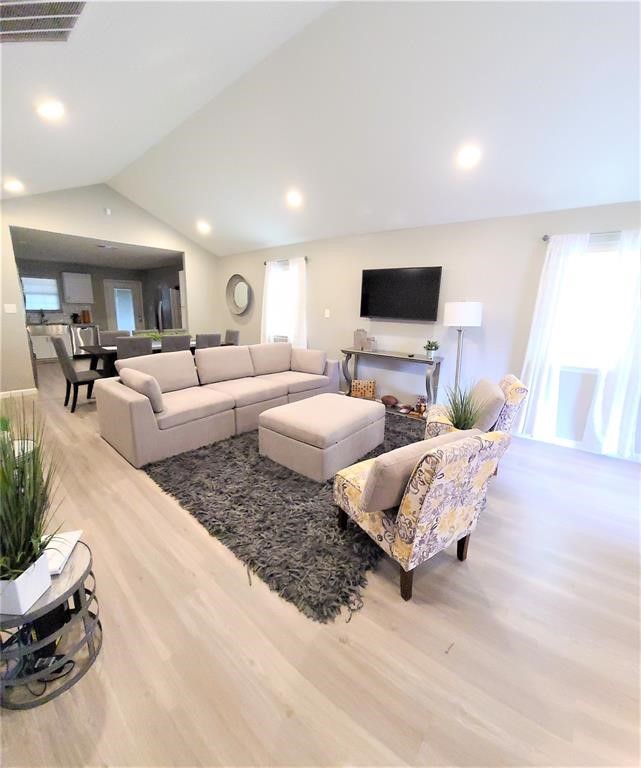 1727 Pueblo Street Dallas, TX 75212 - Photo 5 of 27 a living room with couches and a flat screen tv