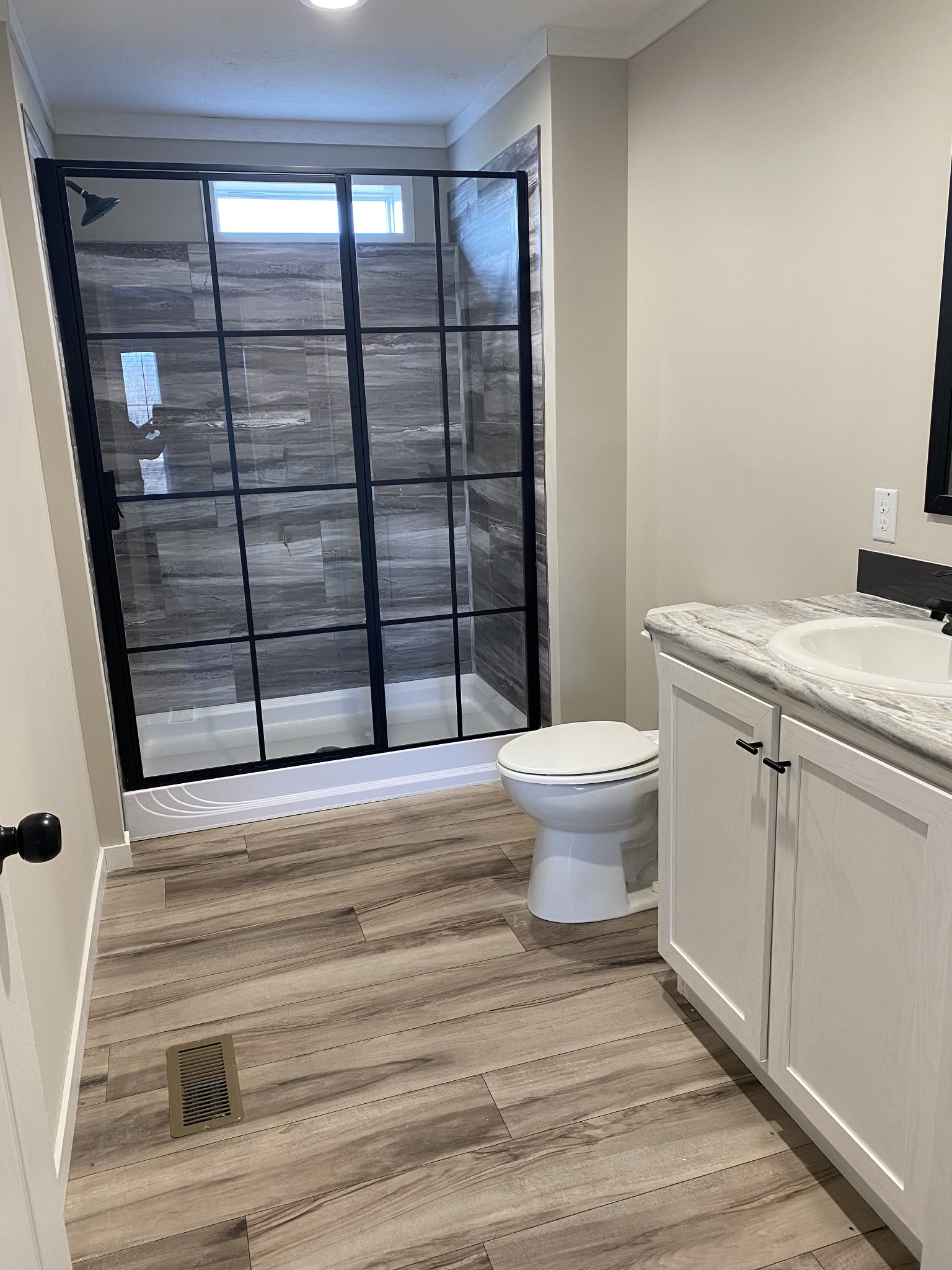 1710 Gamaliel Road Red Boiling Springs, TN 37150 - Photo 11 of 24 a bathroom with a granite countertop toilet and a sink