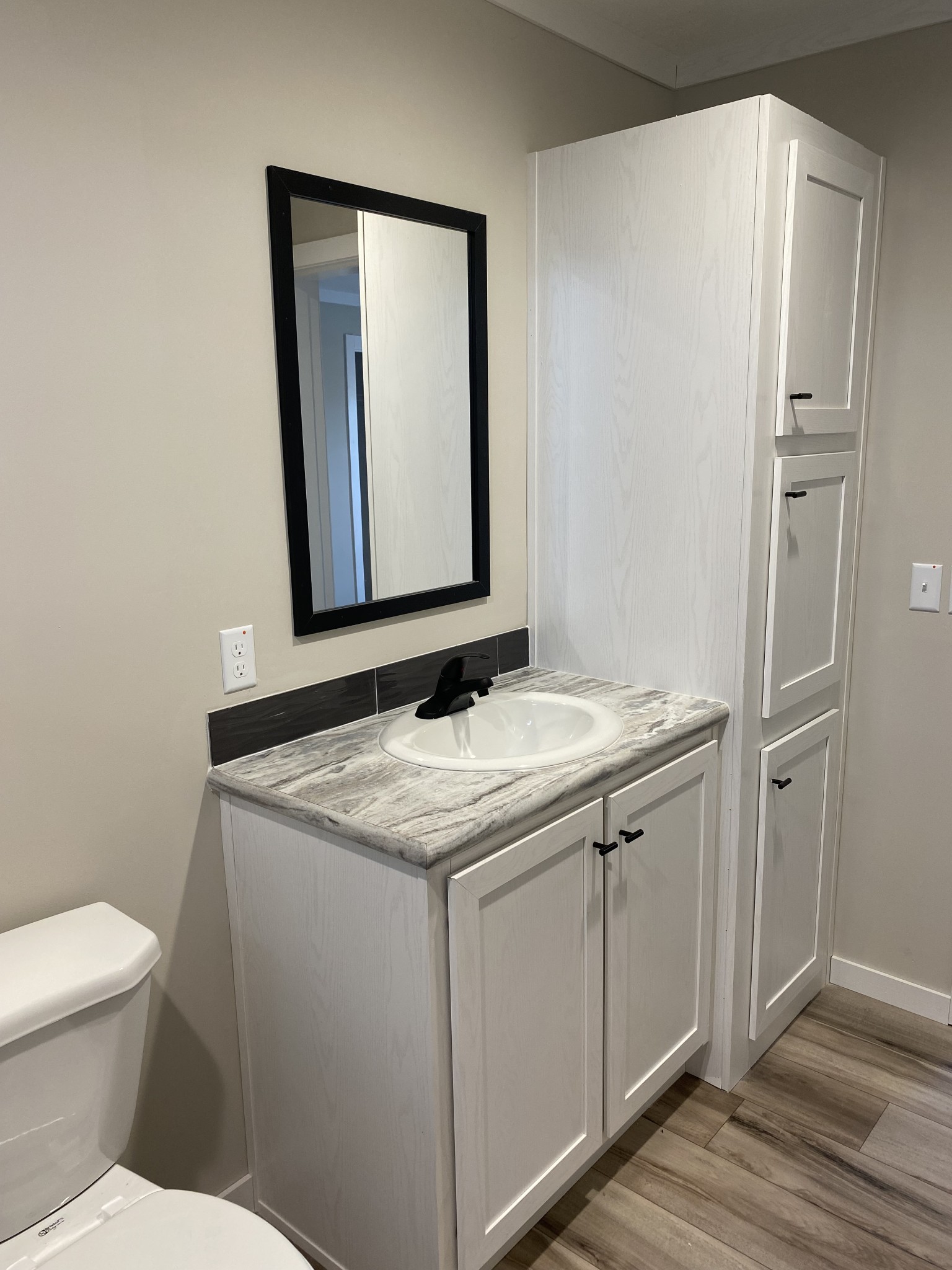 1710 Gamaliel Road Red Boiling Springs, TN 37150 - Photo 13 of 24 a bathroom with a granite countertop sink and a mirror