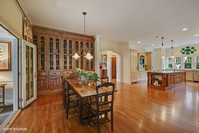 607 West Maple Street Hinsdale, IL 60521 - Photo 12 of 59 a dining room with furniture window wooden floor and a garden
