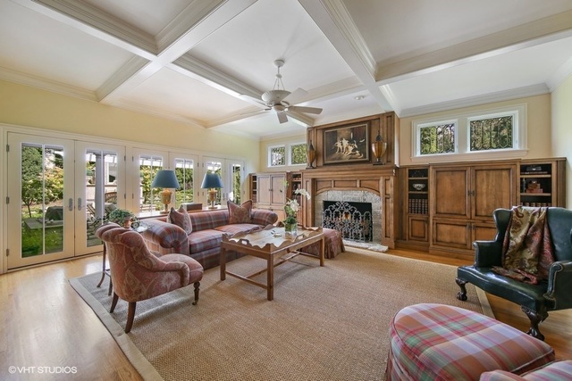 607 West Maple Street Hinsdale, IL 60521 - Photo 14 of 59 a living room with furniture a flat screen tv and a fireplace