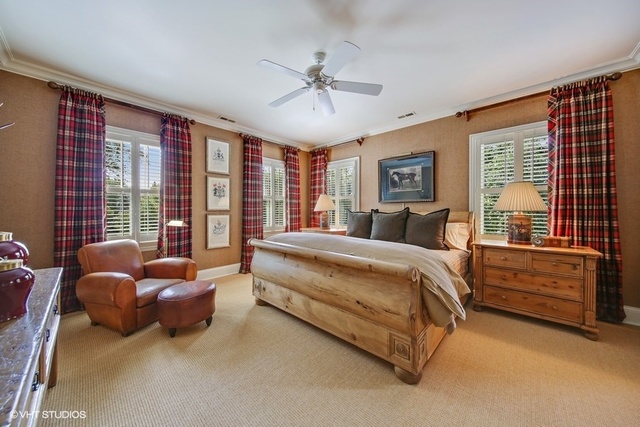 607 West Maple Street Hinsdale, IL 60521 - Photo 26 of 59 a spacious bedroom with a bed and a chandelier
