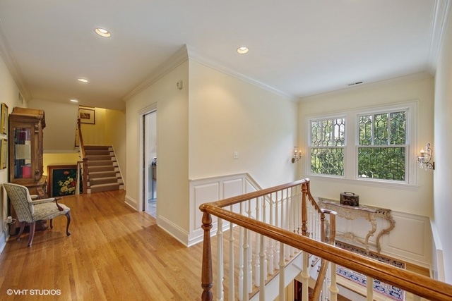 607 West Maple Street Hinsdale, IL 60521 - Photo 32 of 59 a view of a hallway with wooden floor and furniture