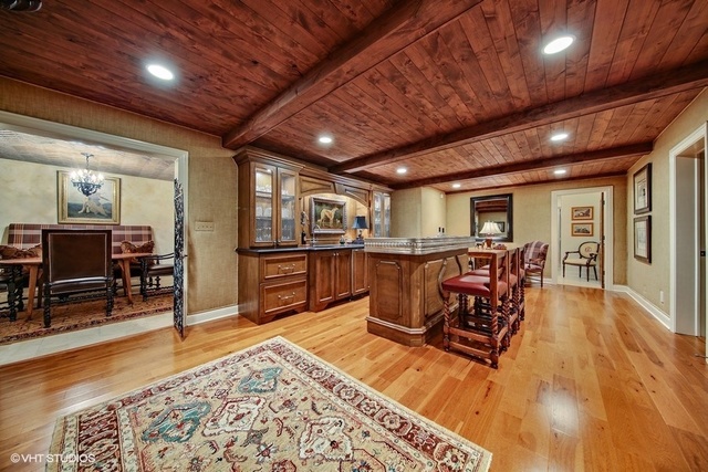 607 West Maple Street Hinsdale, IL 60521 - Photo 33 of 59 a living room with lots of furniture and kitchen view