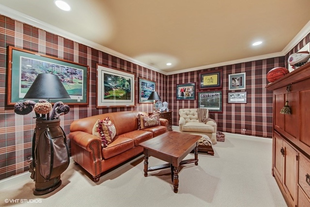 607 West Maple Street Hinsdale, IL 60521 - Photo 37 of 59 a living room with furniture a flat screen tv and a floor to ceiling window