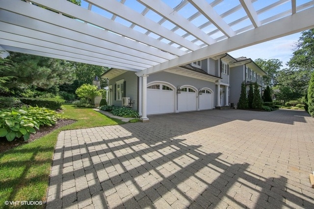 607 West Maple Street Hinsdale, IL 60521 - Photo 48 of 59 a front view of a house with a garden and plants