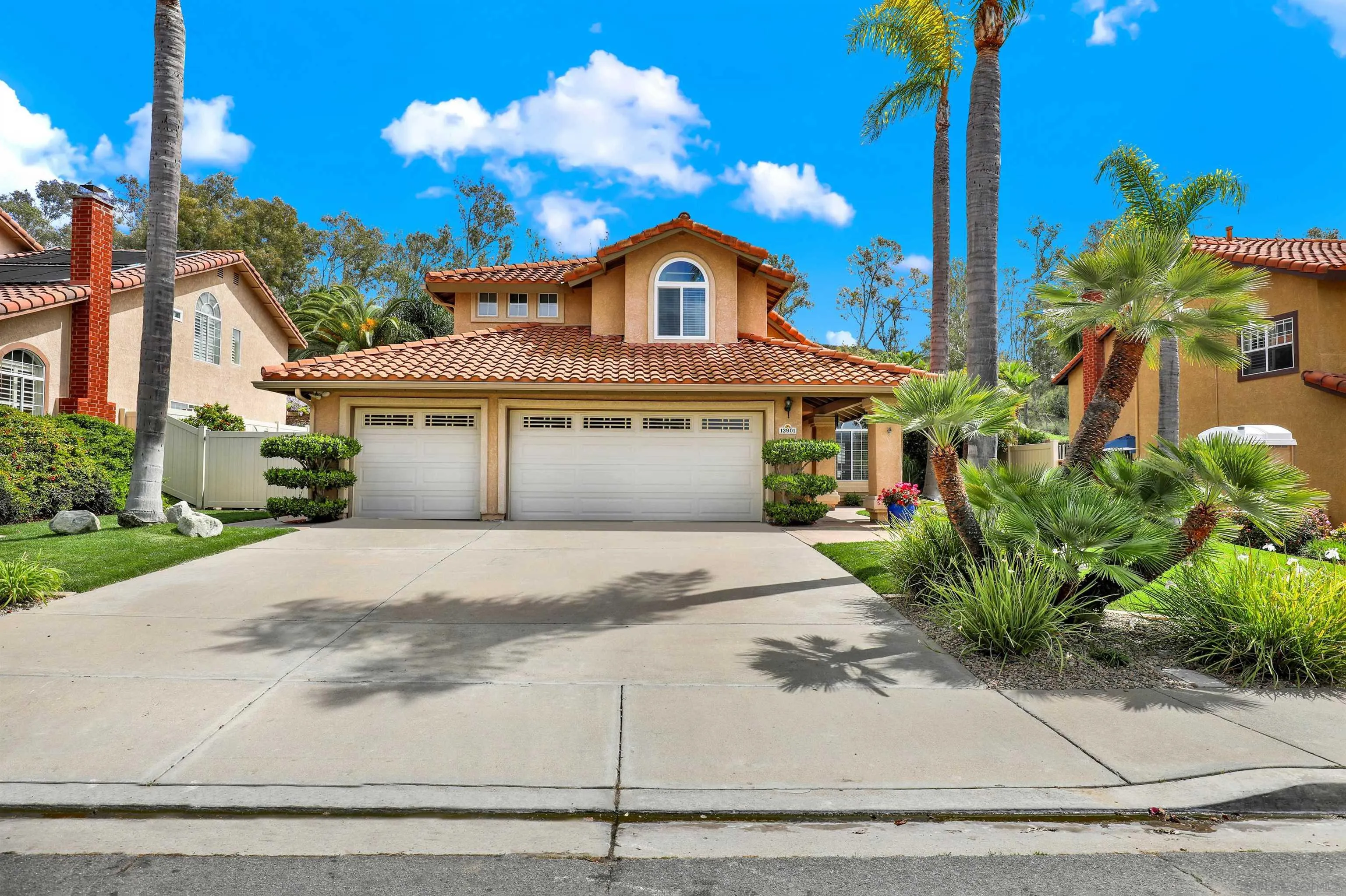13901 Carriage Road Poway, CA 92064 - Photo 1 of 37 a front view of a house with a yard and potted plants