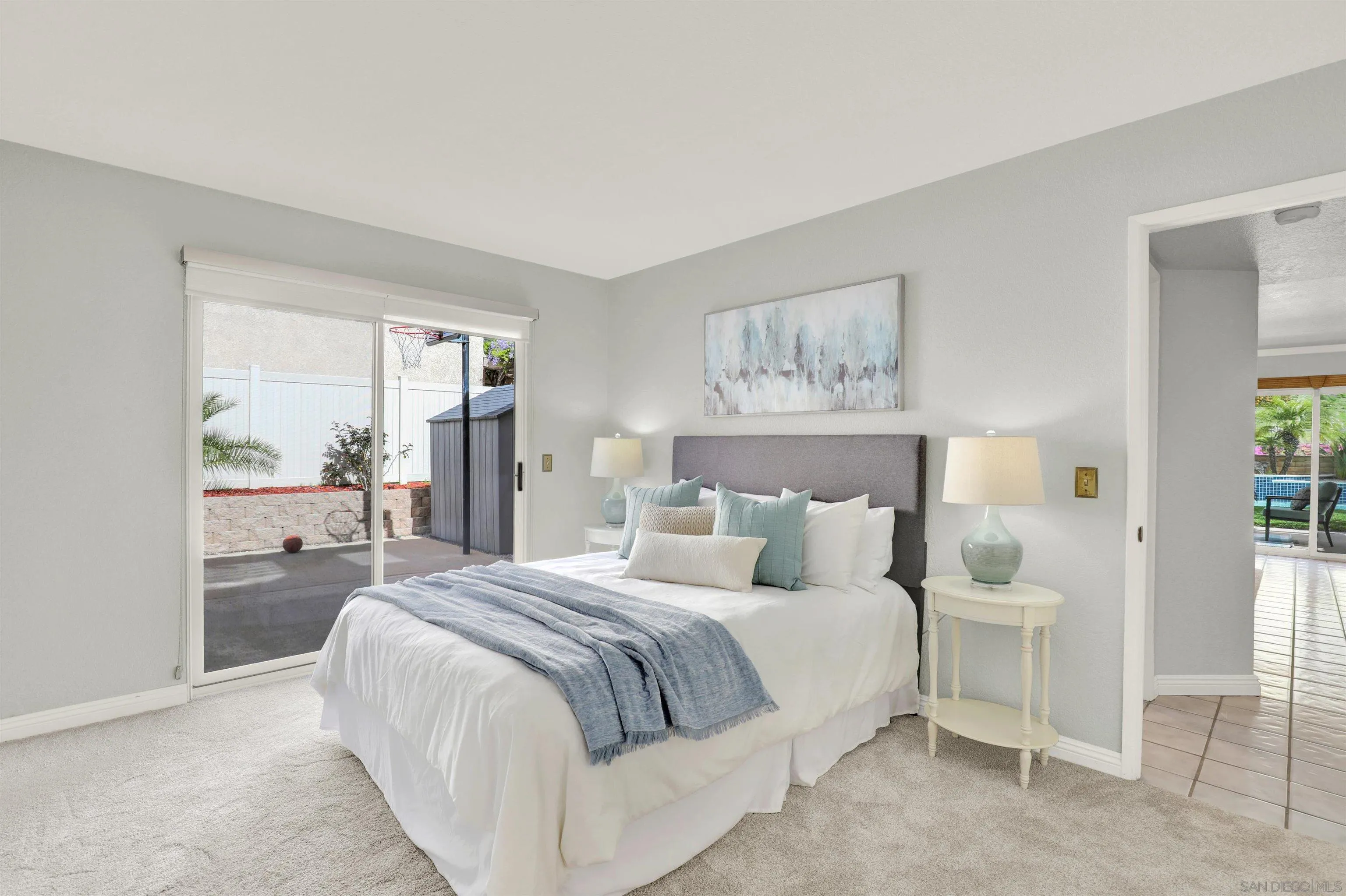 13901 Carriage Road Poway, CA 92064 - Photo 15 of 37 a bedroom with a large bed and a window