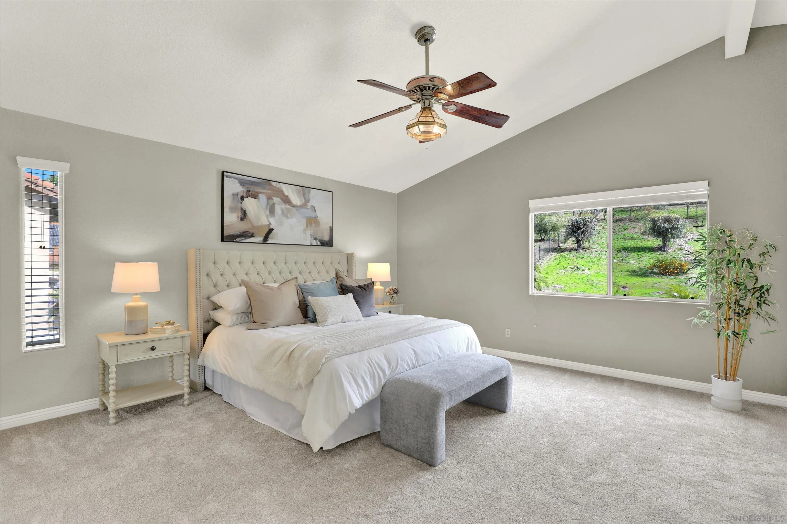 13901 Carriage Road Poway, CA 92064 - Photo 18 of 37 a bedroom with a bed and a chandelier