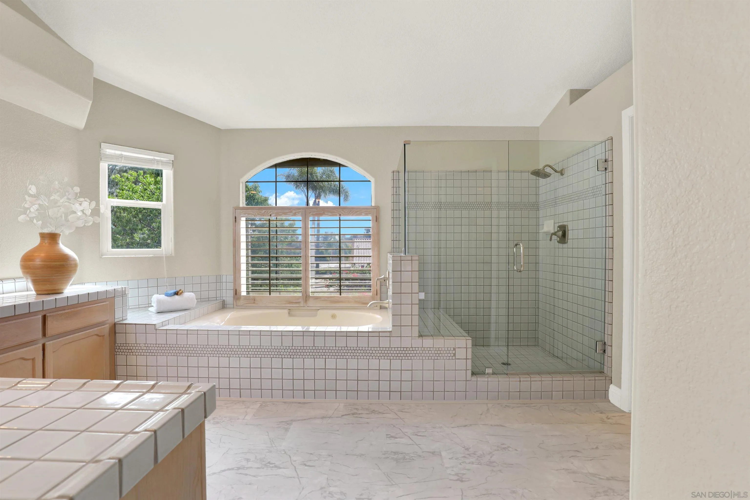 13901 Carriage Road Poway, CA 92064 - Photo 19 of 37 a bath room with a bath tub and a shower