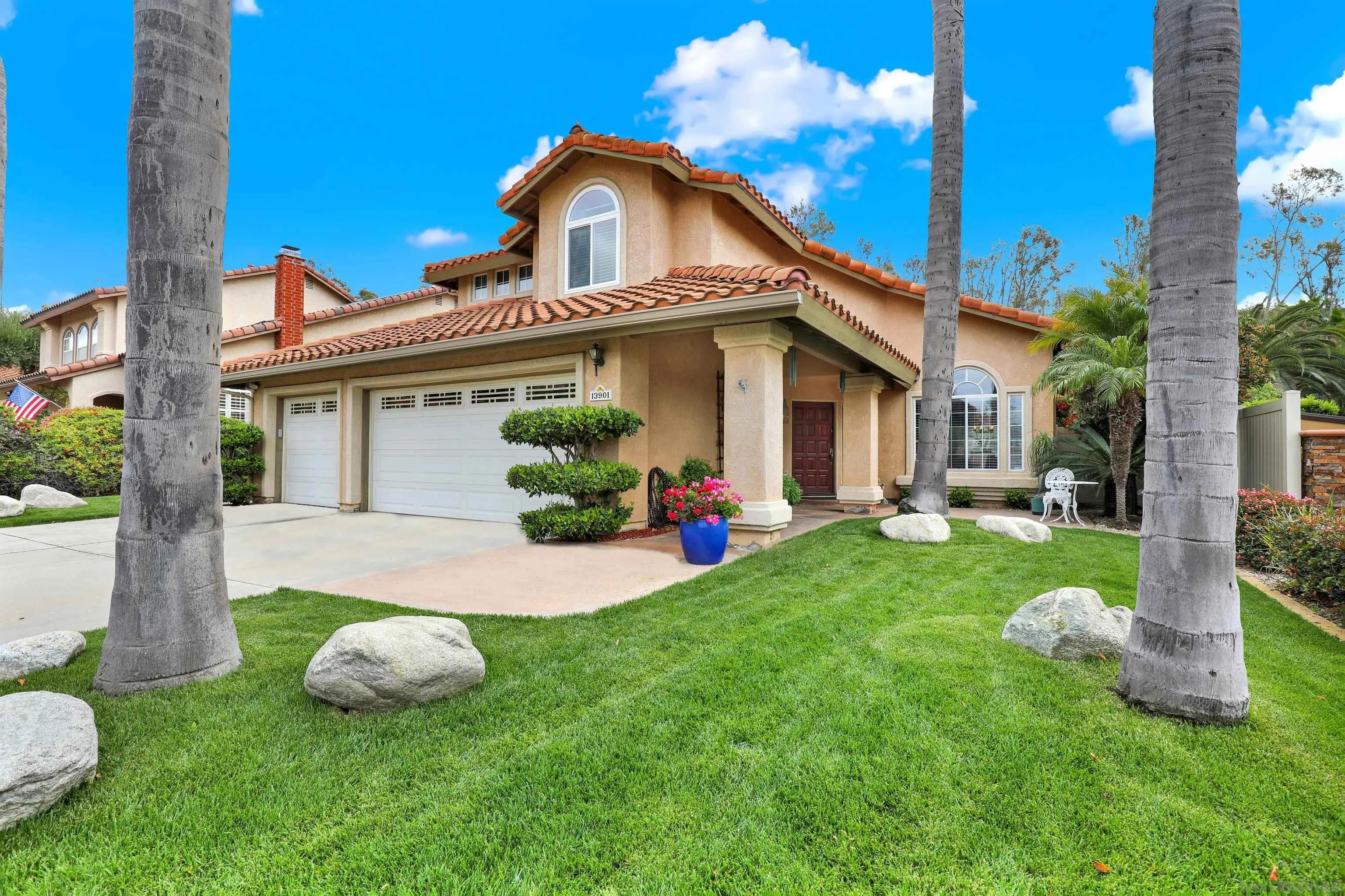 13901 Carriage Road Poway, CA 92064 - Photo 2 of 37 a front view of a house with garden