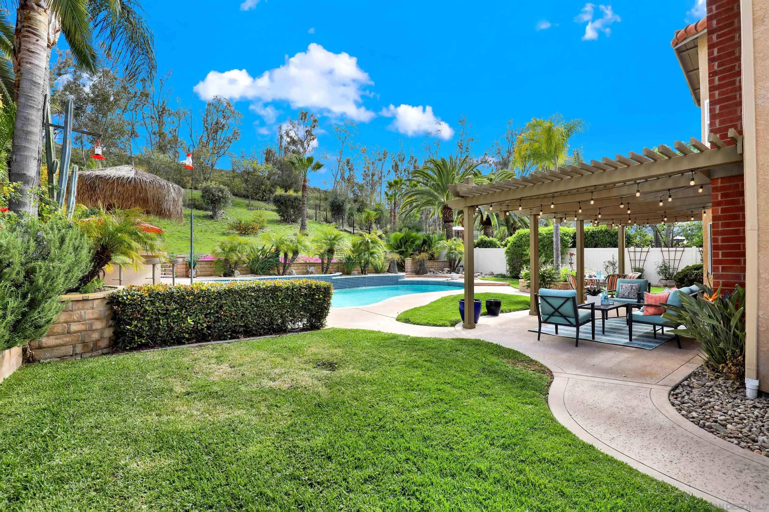 13901 Carriage Road Poway, CA 92064 - Photo 30 of 37 a view of a fountain in front of a house with a big yard
