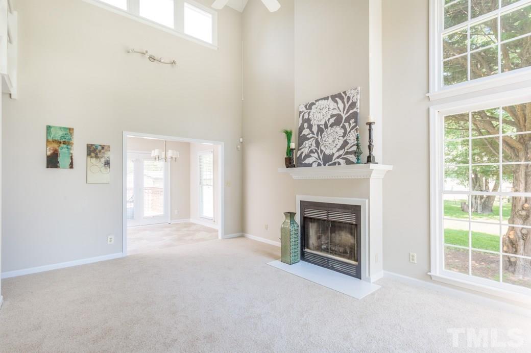 2804 Kempsford Place Raleigh, NC 27604 - Photo 3 of 11 a view of an empty room with window and fire place
