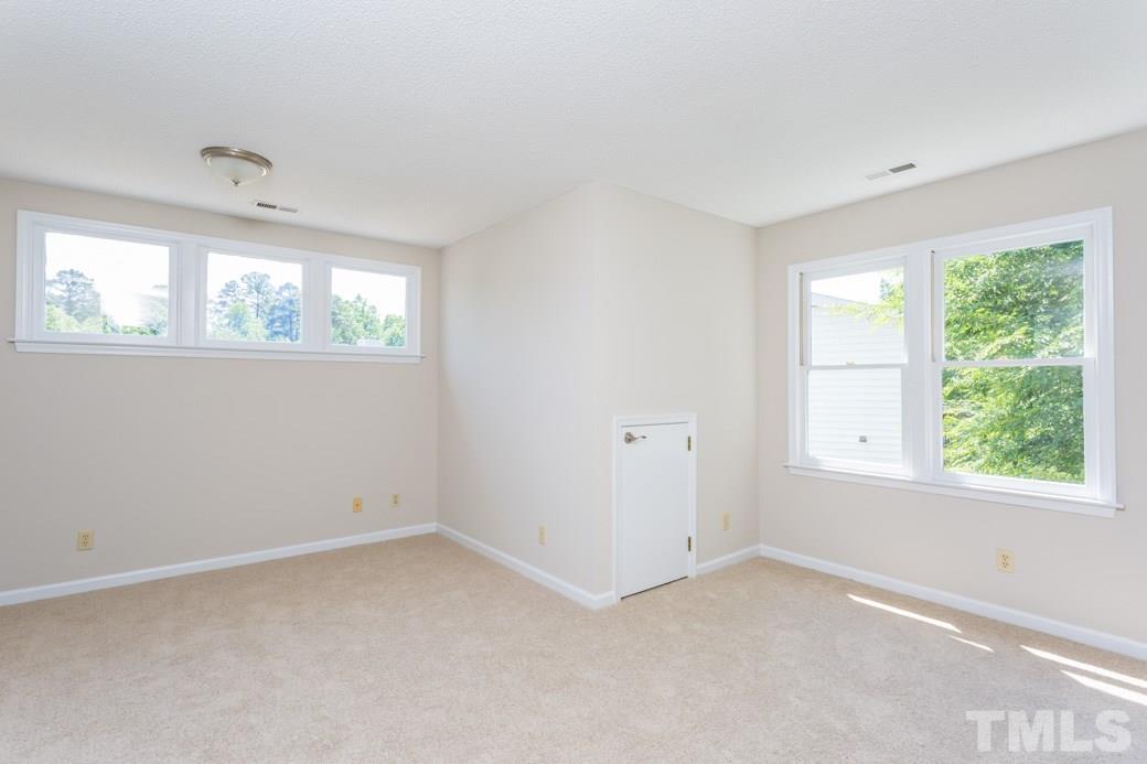 2804 Kempsford Place Raleigh, NC 27604 - Photo 7 of 11 an empty room with windows