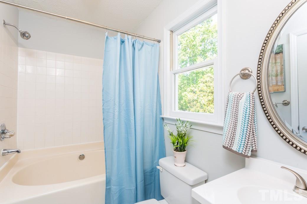 2804 Kempsford Place Raleigh, NC 27604 - Photo 8 of 11 a bathroom with a sink toilet and shower