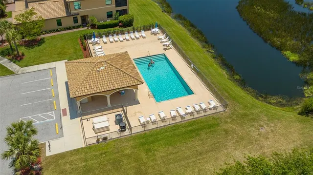 an aerial view of a swimming pool and outdoor space