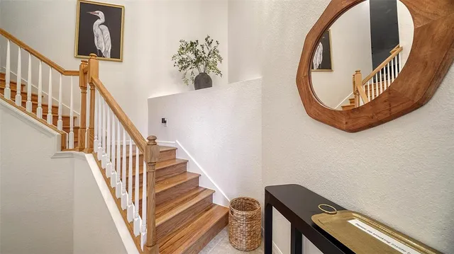 a living room with fireplace furniture and a large window