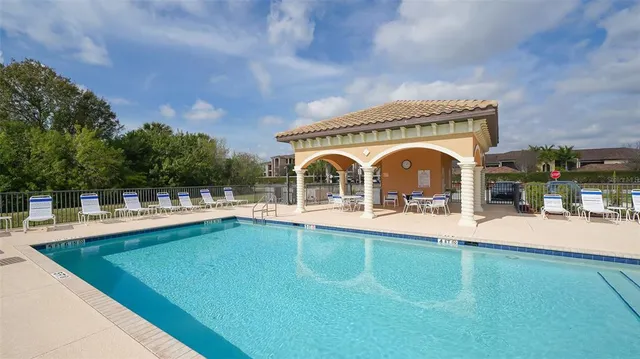 a front view of multi story residential apartment building with a yard