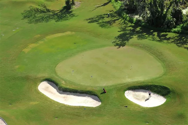 a view of a house with backyard porch and furniture