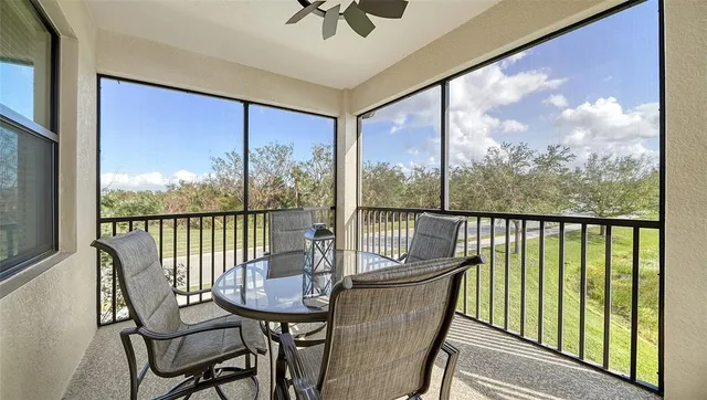 a view of a dining room with furniture and window