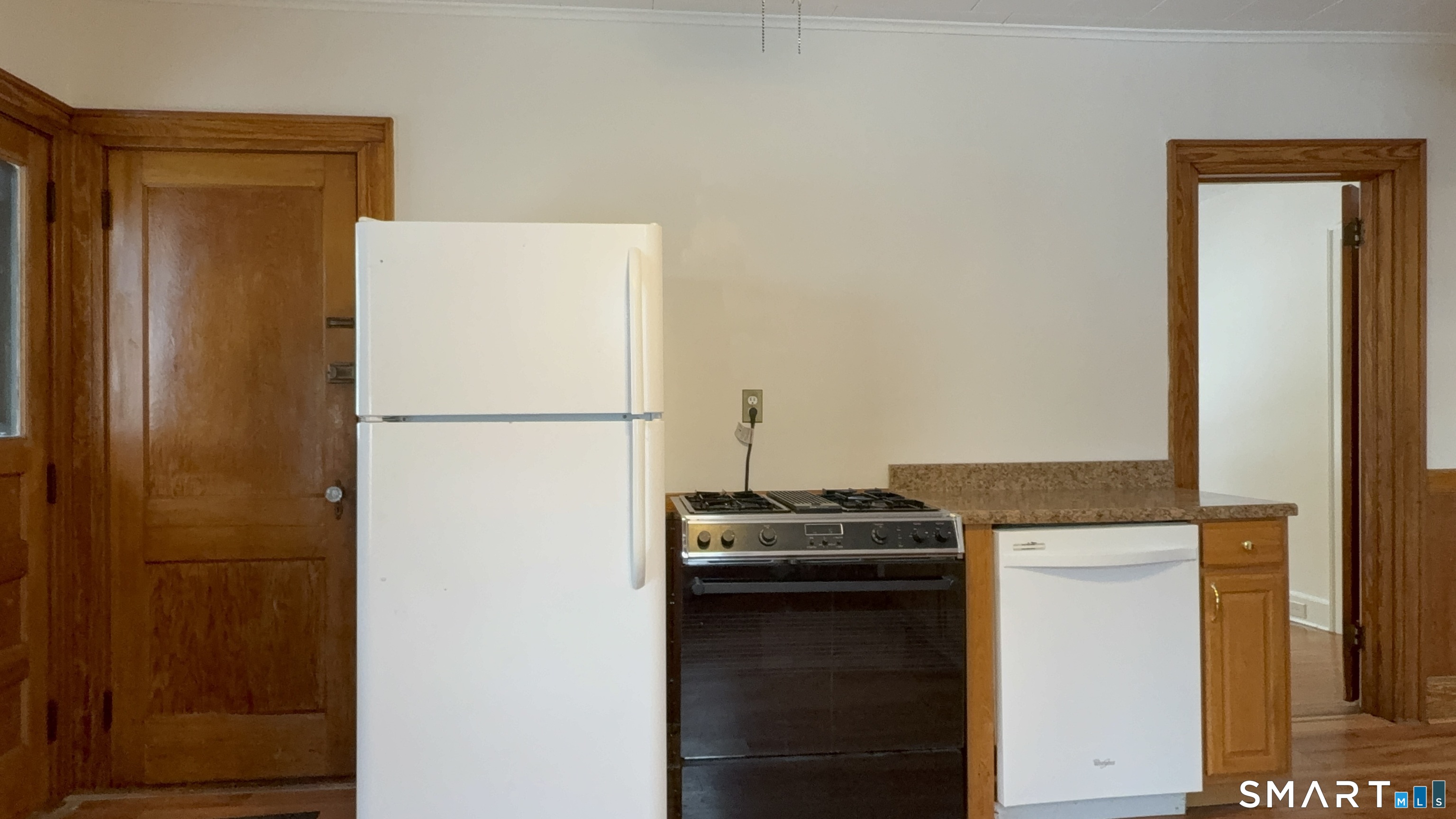 415 Litchfield Street Torrington, CT 06790 - Photo 11 of 23 a kitchen with a refrigerator and a stove
