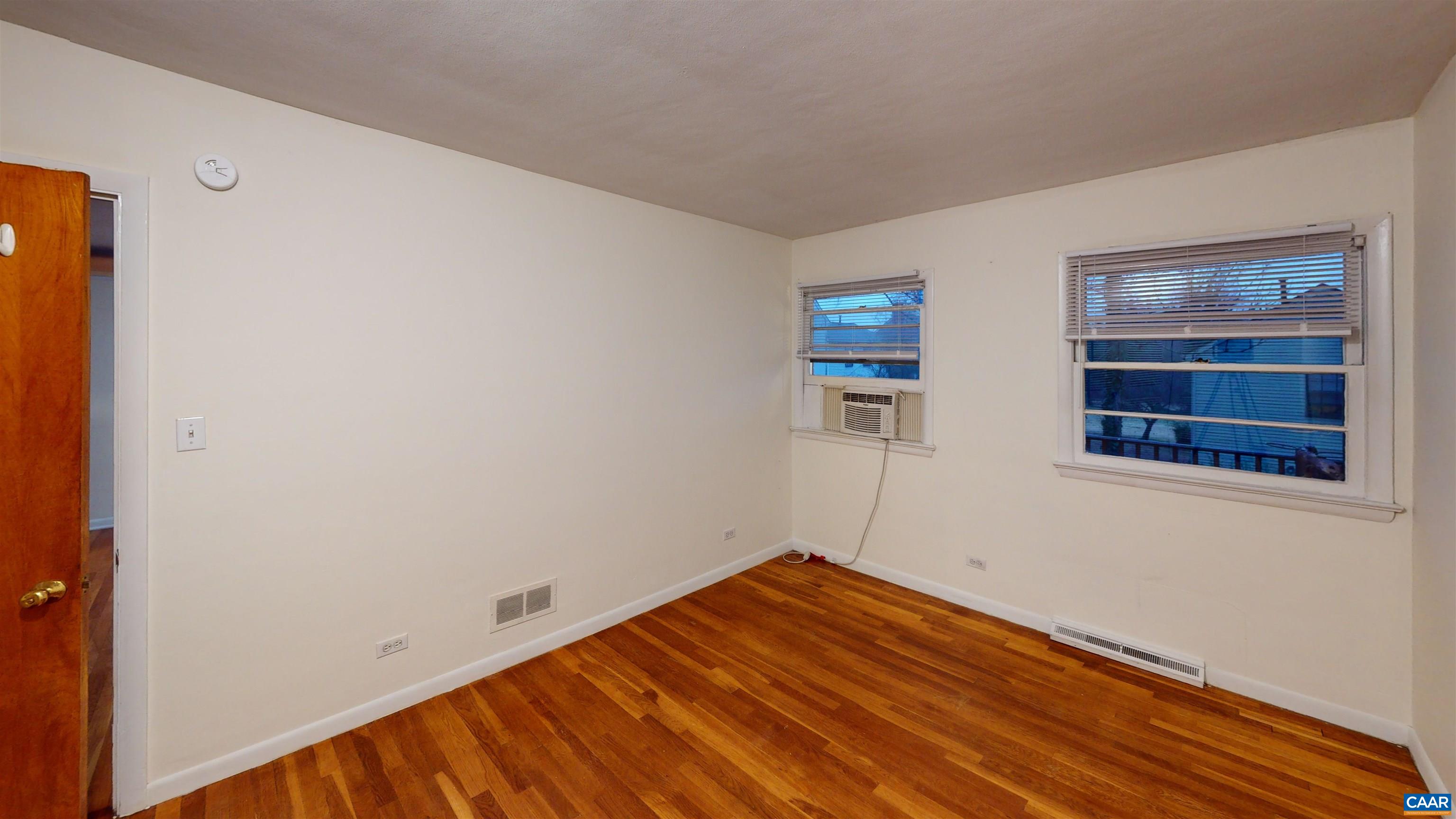 130 Apple Tree Road, Unit A Charlottesville, VA 22903 - Photo 10 of 16 a view of empty room with wooden floor