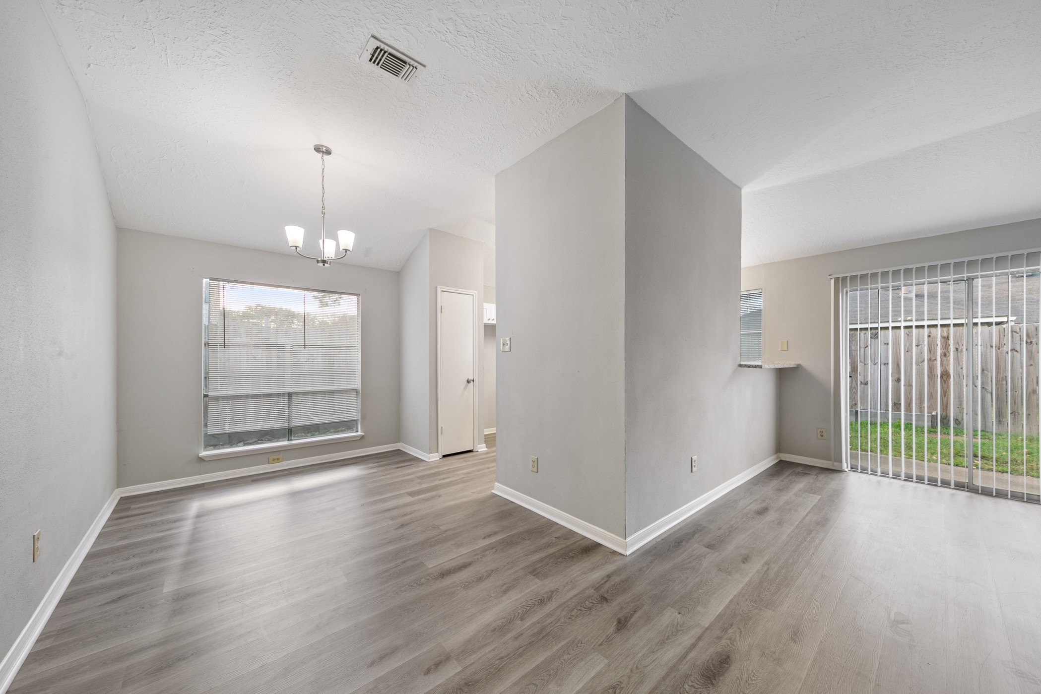 10530 Rippling Fields Drive Houston, TX 77064 - Photo 14 of 29 an empty room with wooden floor and window